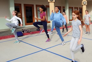Allyson Felix high steps with Turning Point students, as they train for the Screenland 5K.  Photo, Courtney Baker