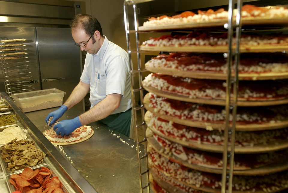 Preparing pizza at Marion’s in suburban Dayton